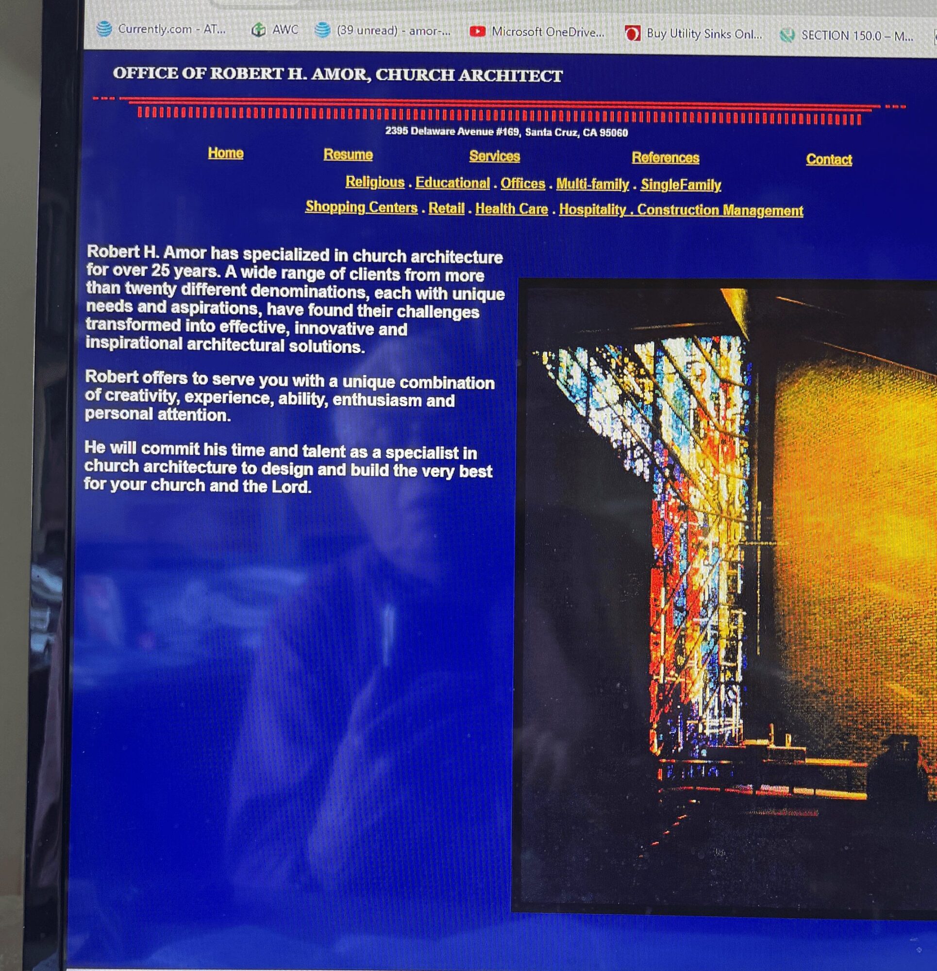 Website page for Robert H. Amor, church architect, with a colorful stained glass window image on the right and text on the left.