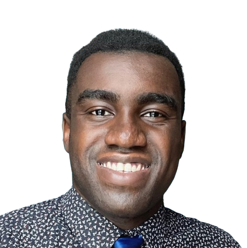 Portrait of a smiling man with short hair, wearing a patterned shirt and a dark tie, against a black background.