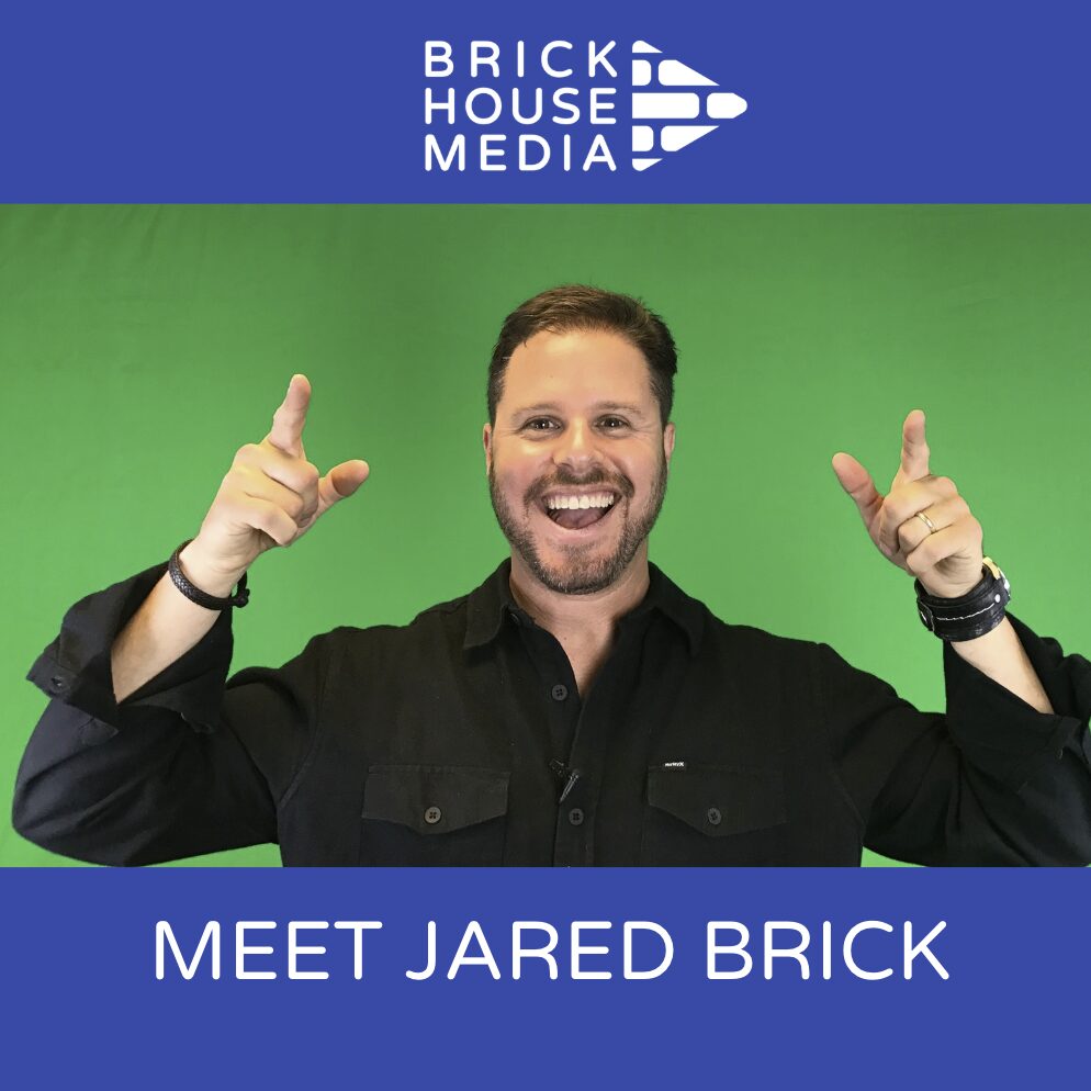 Man smiling and pointing with both hands, green background, blue banner with white text, logo at top, text below image.