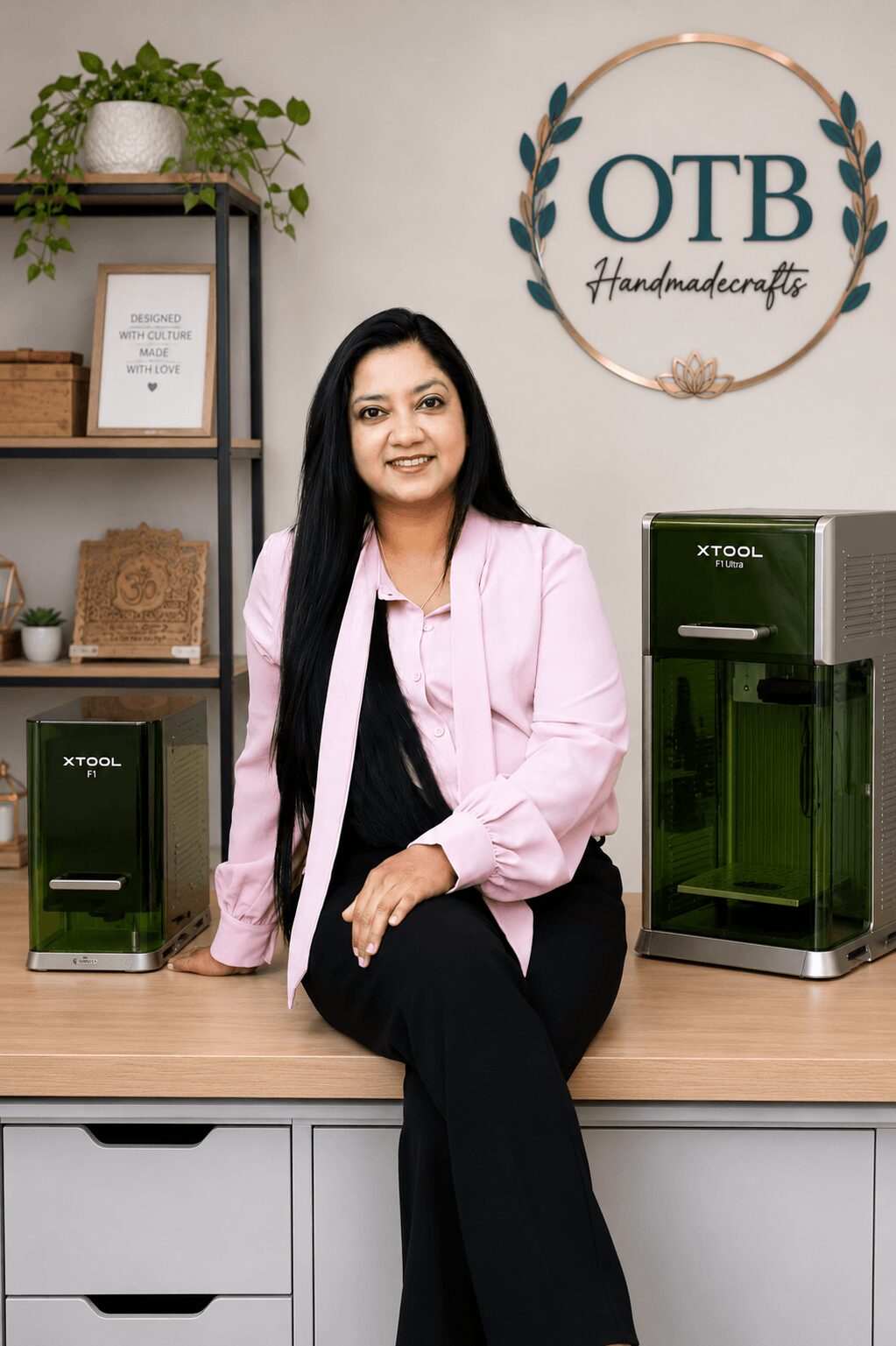 Woman sitting on a counter in a room with shelves, plants, and water dispensers, smiling at the camera.