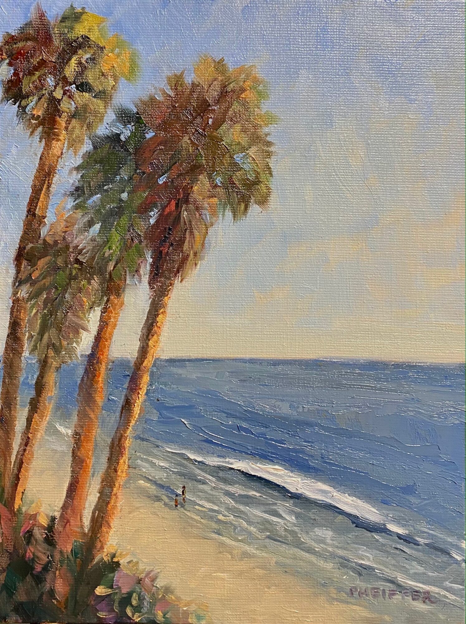 Beach scene with tall palm trees, sandy shore, and ocean waves under a clear sky.